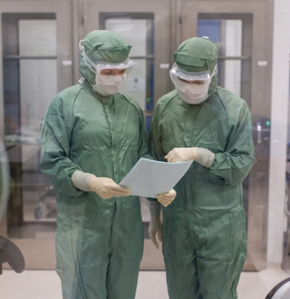 Cell therapy operators studying paperwork